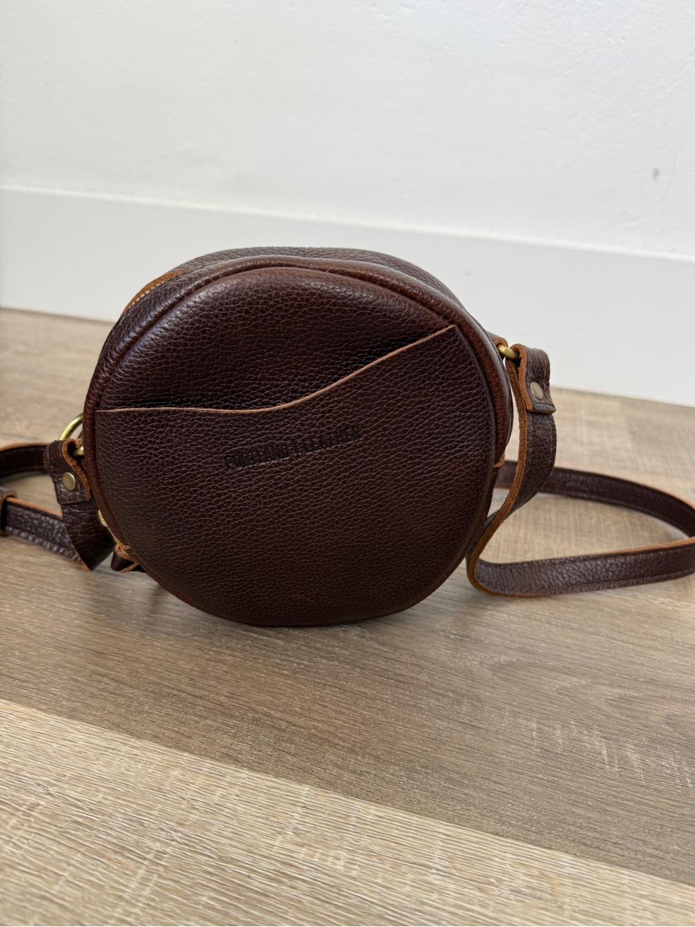 Portland Leather Almost Perfect Small Circle Pebbled Dark Brown Crossbody Bag